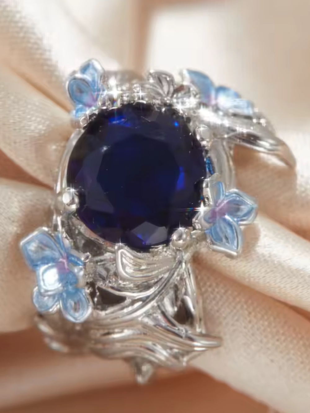 Silver Ring with Deep Blue Center and Blue Floral Accents - Picture 2 of 4